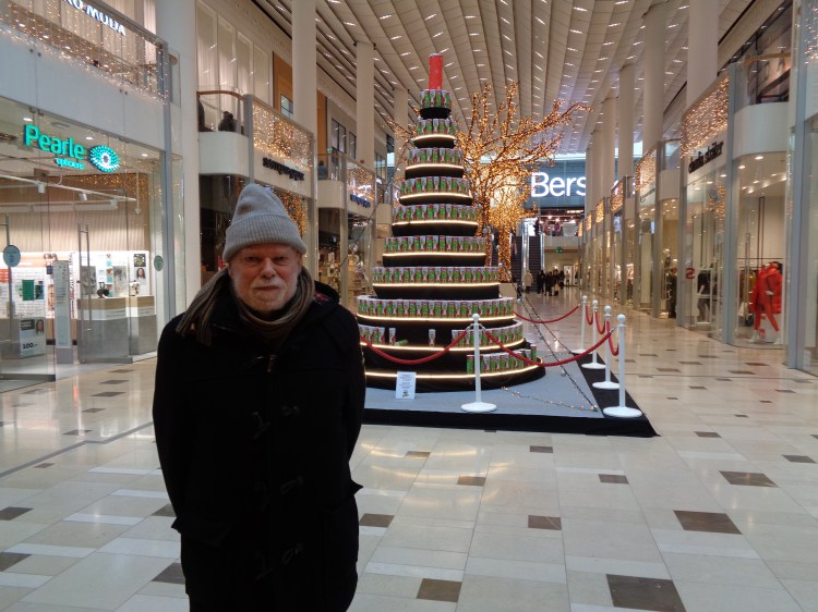 man in cone hat honors Pringles tree